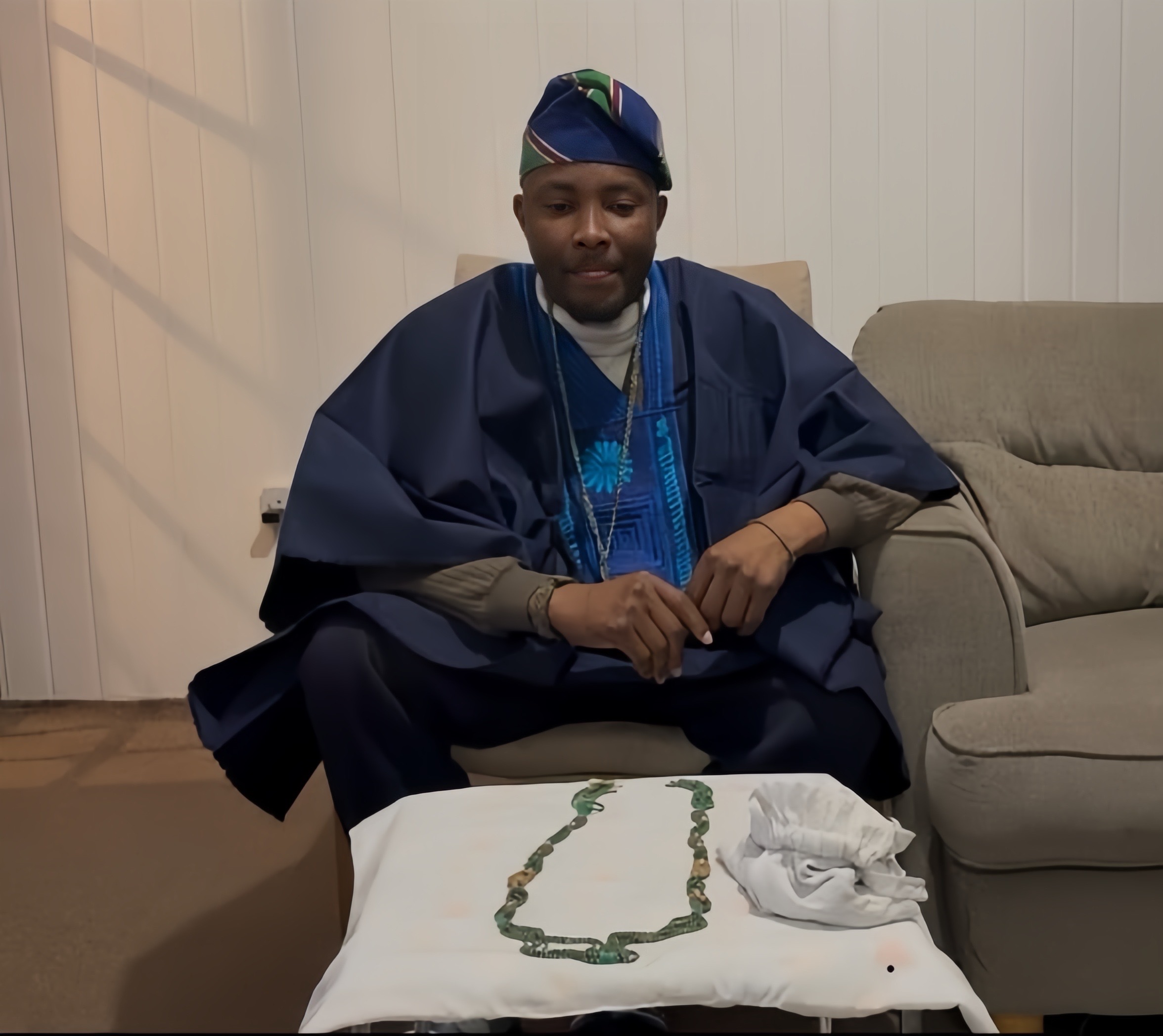Babaláwo Dr. Faniyi Adebanjo Adifagbola in traditional attire